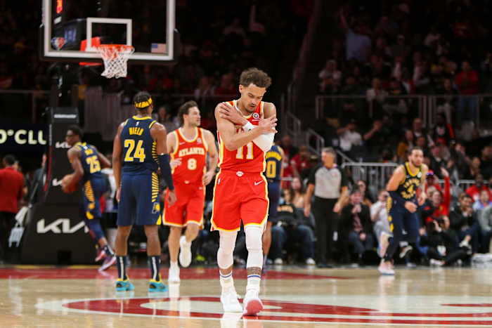 Mar 13, 2022; Atlanta, Georgia, USA; Atlanta Hawks guard Trae Young (11) shows emotion after a basket against the Indiana Pacers in the second quarter at State Farm Arena.